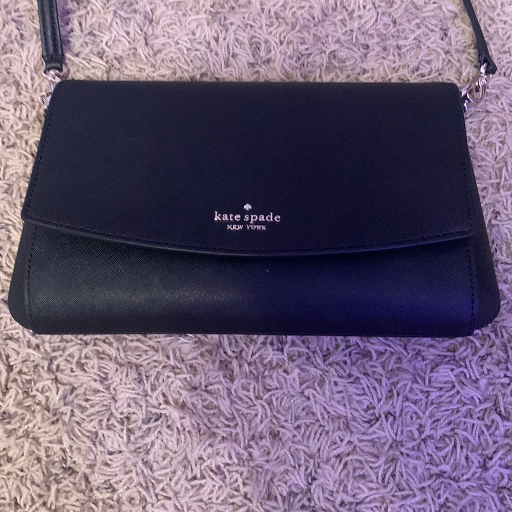 Black Kate spade purse only used once in great condition.